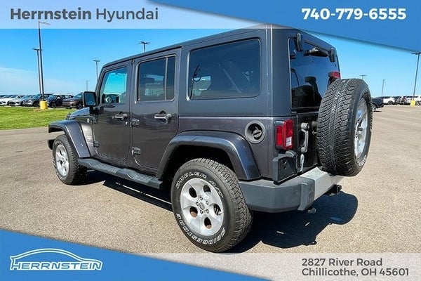 2014 Jeep Wrangler Unlimited Sahara in Chillicothe, OH - Herrnstein Auto Group